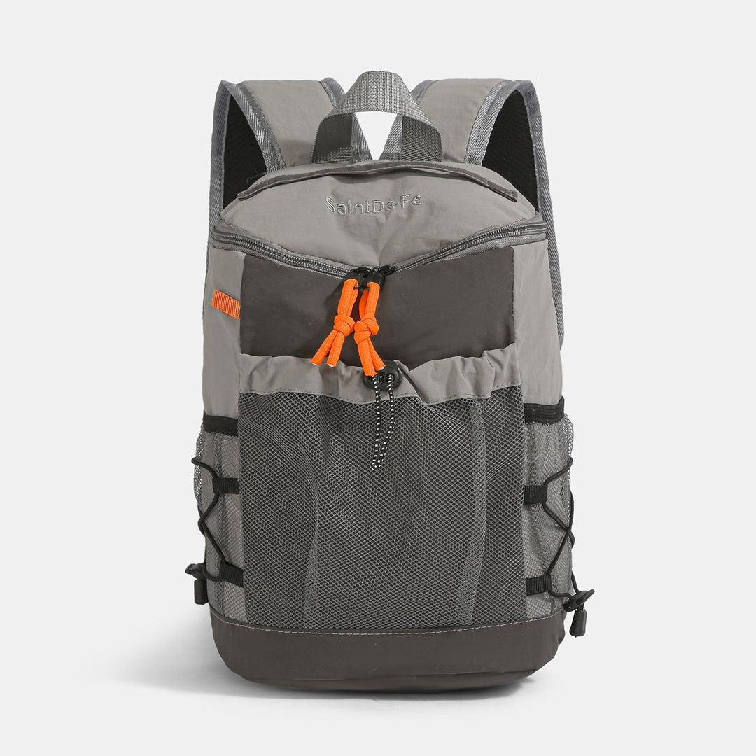 Unisex adventure backpack in action, ideal for hiking, camping & outdoor travel, durable design for all terrains.
