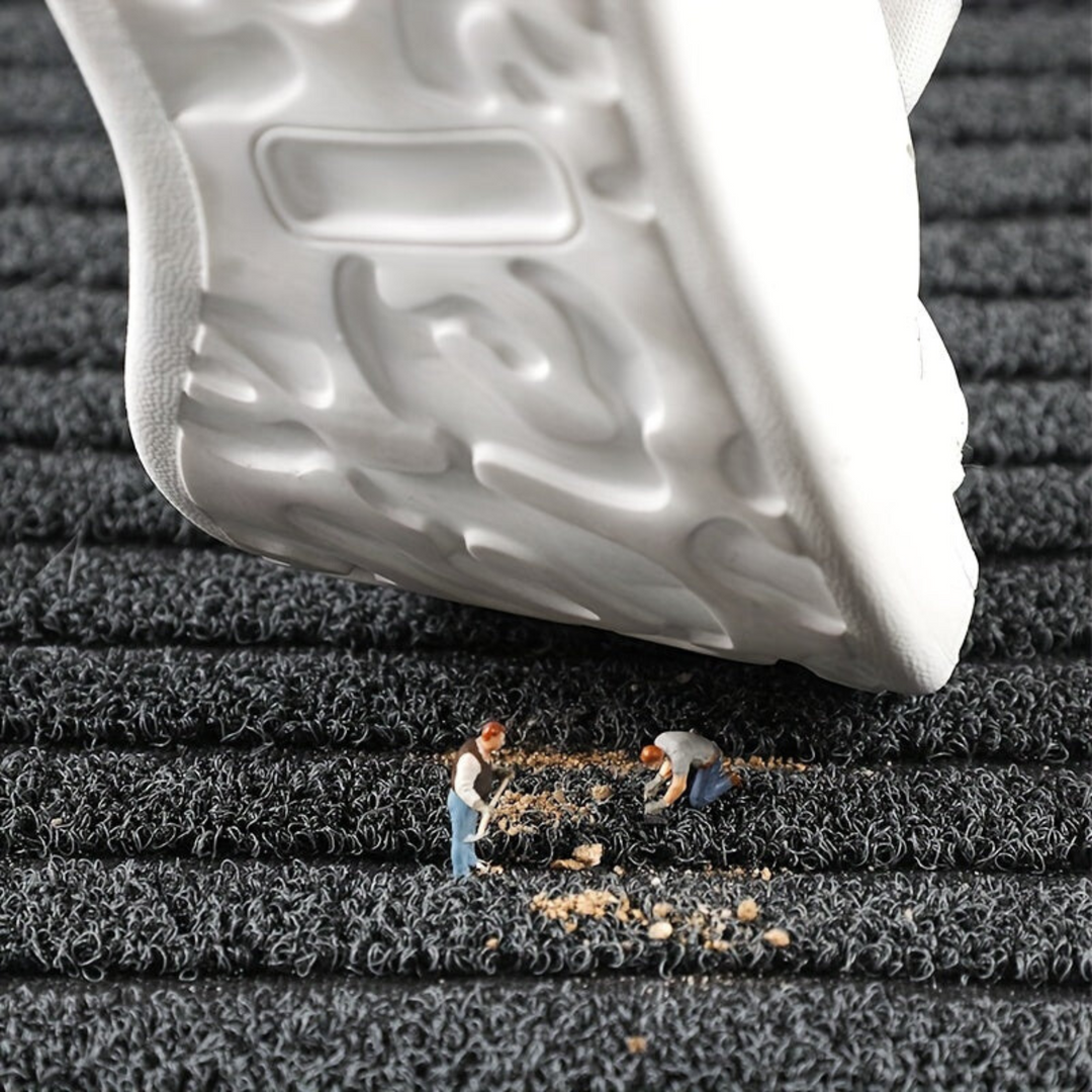 Gray weatherproof non-slip outdoor entryway mat. Durable and washable floor rug for front doors and patios.