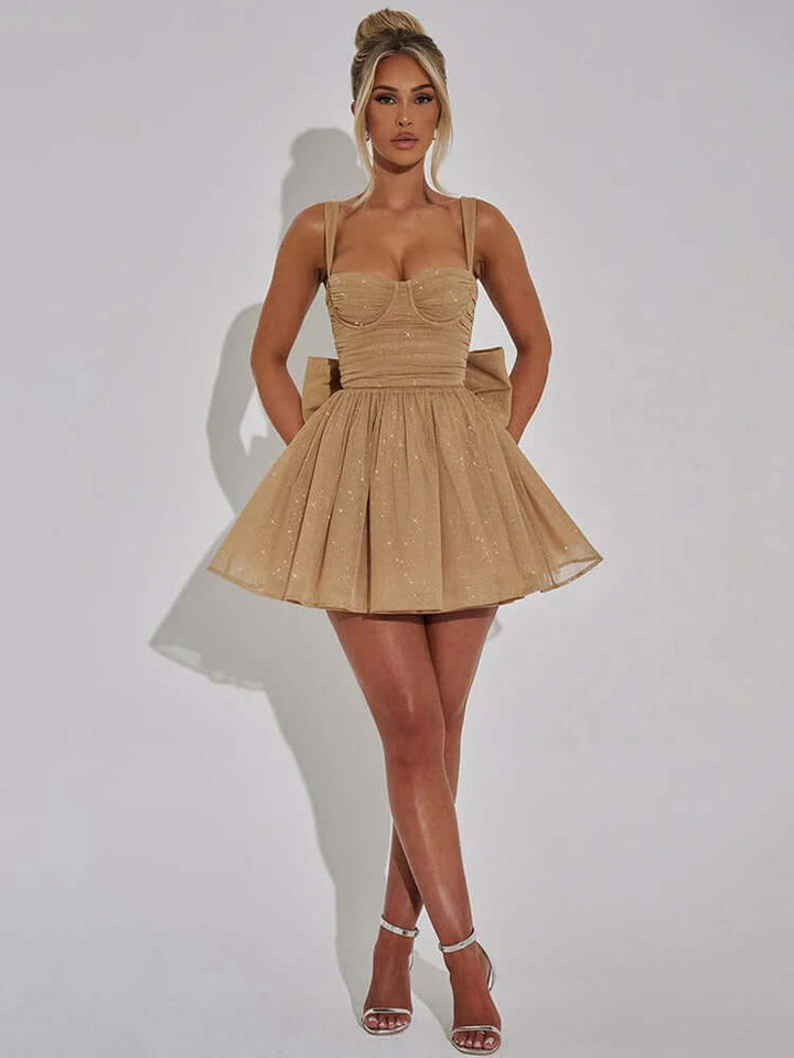 Gorgeous women's cocktail dress featuring a chic bow back. This A-line party dress is perfect for any special occasion.