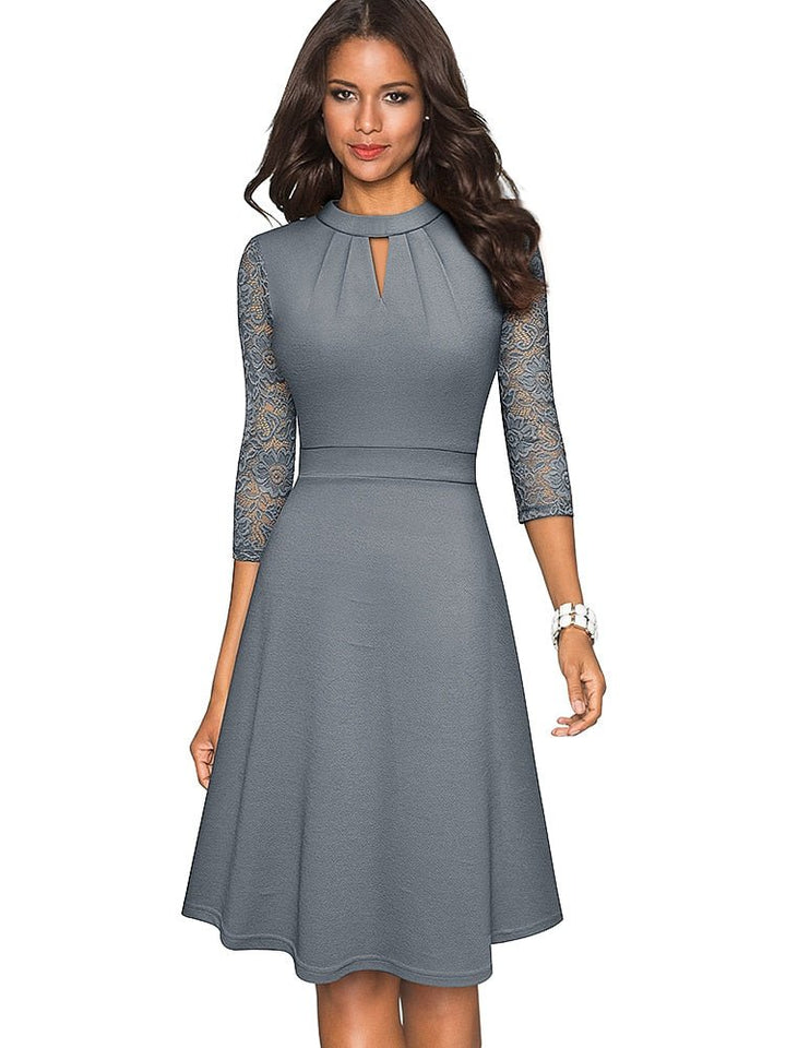 Stylish women's A-line party dress with elegant lace sleeves and a high neck. Versatile semi-formal fashion.
