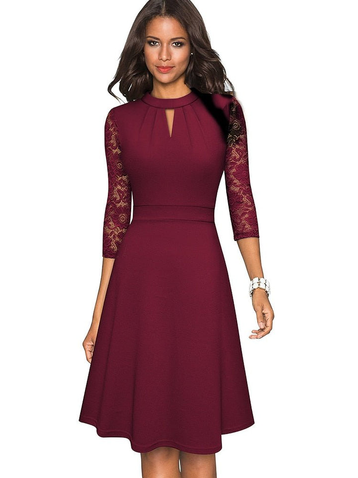 Sophisticated women's special occasion A-line dress with graceful lace sleeves. Perfect cocktail or party wear.