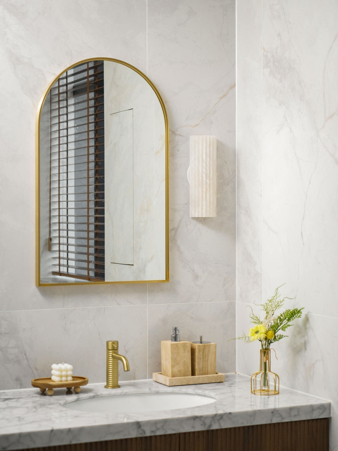 Clean-lined alabaster wall sconce, a modern LED lamp providing elegant architectural lighting.