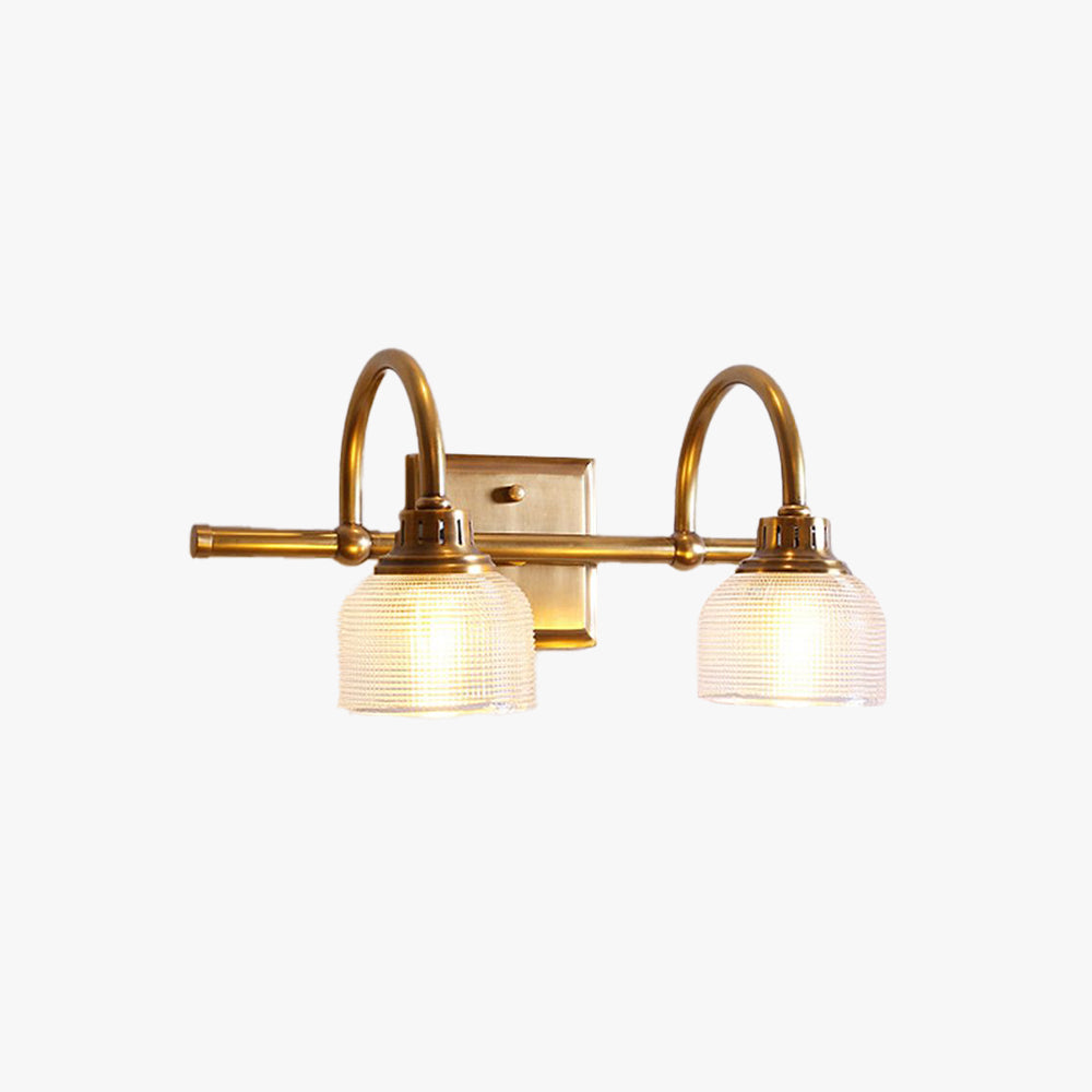 Elegant antique brass wall sconce with textured glass, perfect for warm home illumination.