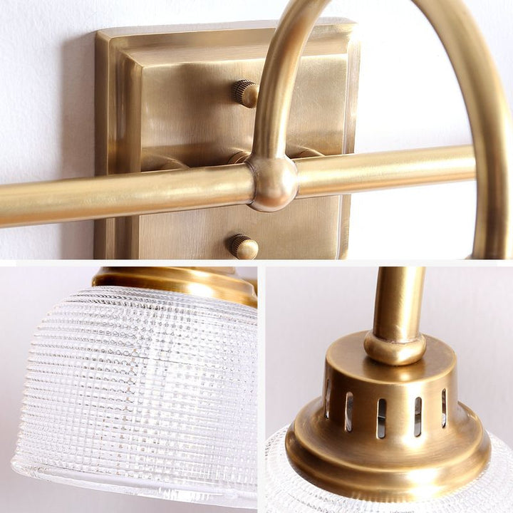 Versatile antique brass wall light, perfect for bathroom, bedroom, or living room lighting.