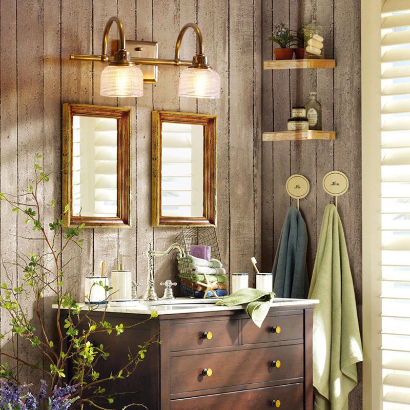 Textured glass antique brass wall sconce, an elegant hardwired lamp for indoor lighting.