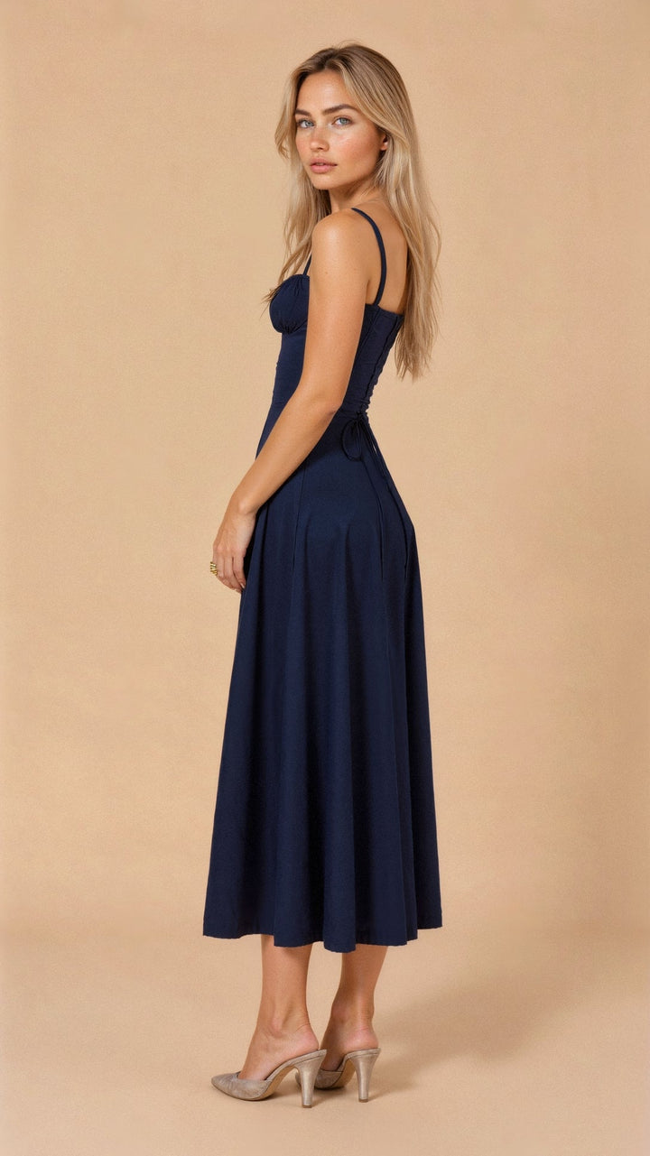 Women's sleeveless summer dress with a delicate bow detail and sweetheart neck.