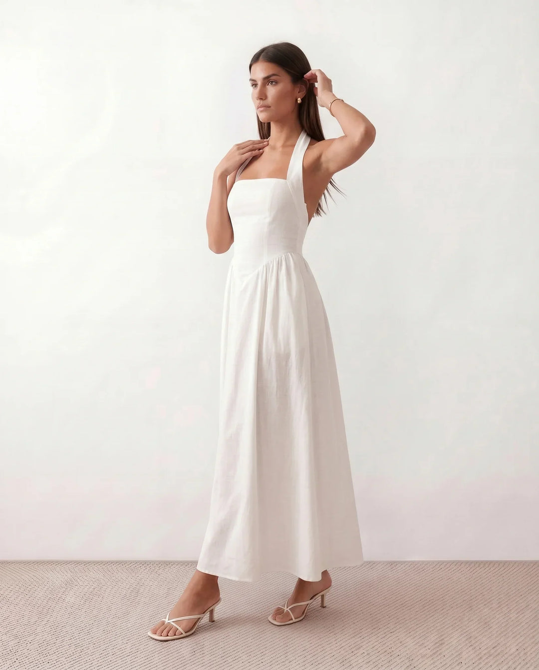 Chic Aurora Halter Maxi Dress for women. Features an elegant basque waist, ideal as a vacation or party dress.