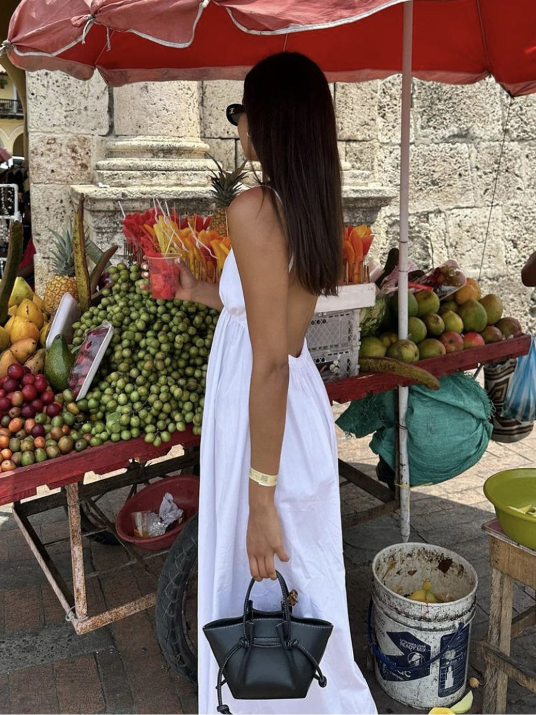 Sleeveless V-neck A-line midi dress. Women's elegant backless design, great for party and occasion wear.