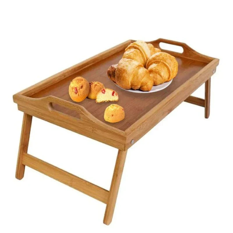 Elegant bamboo bed tray table with folding legs, perfect for breakfast in bed, reading, or laptop use.