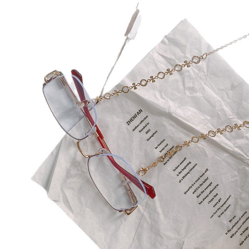 Decorative beaded glasses chain for women, adding elegance & convenience. Features trendy charms.