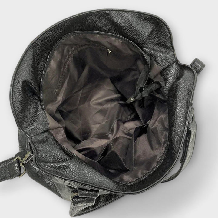 Versatile black hobo shoulder bag for women, an elegant everyday fashion accessory.