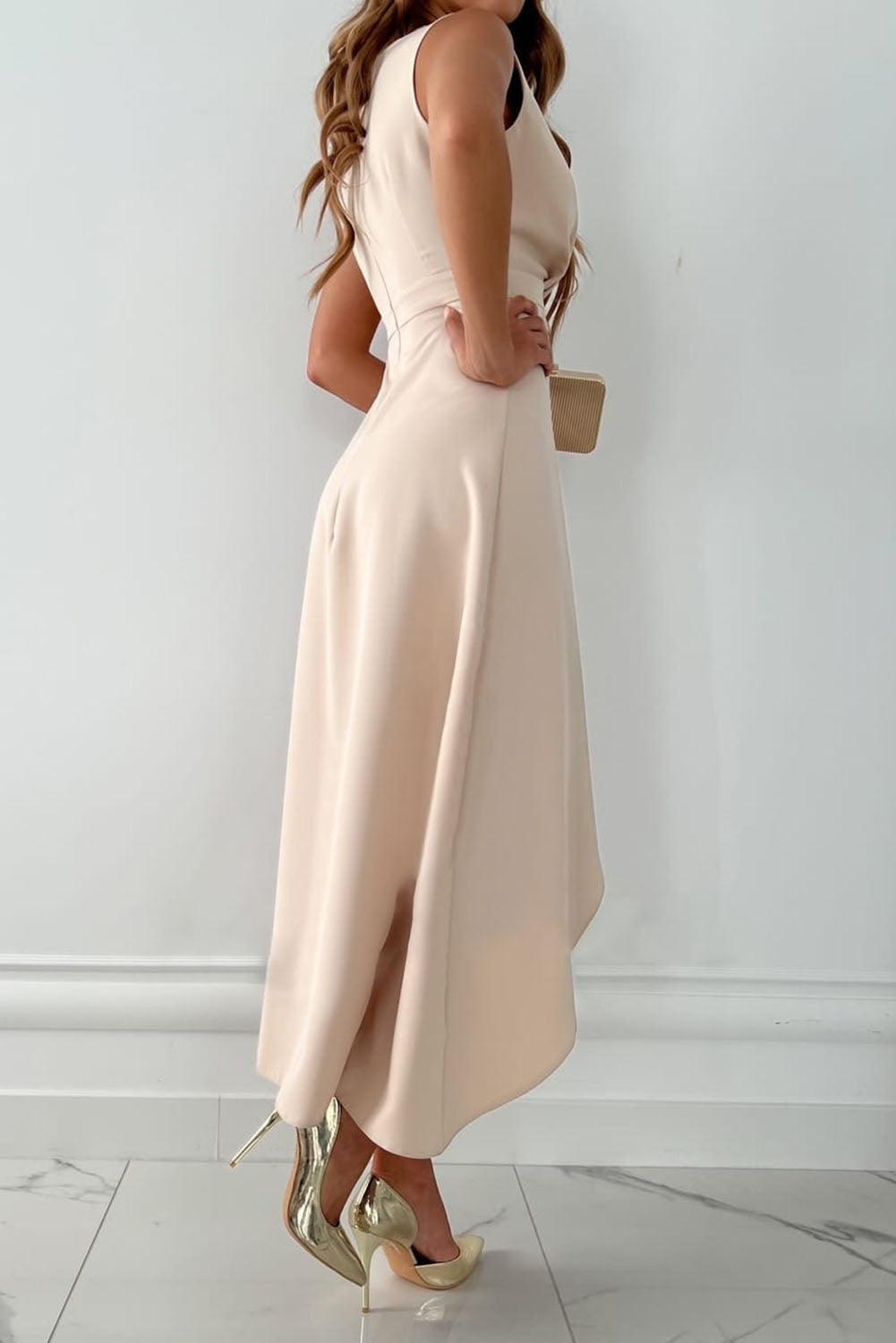 Flattering women's V-neck wrap dress in beige, offering timeless style for both casual and elegant occasions.