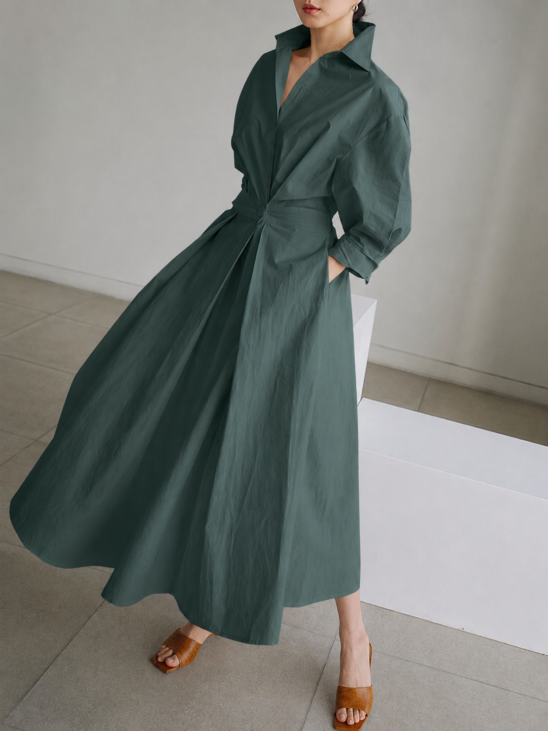Chic and comfortable women's button-front midi shirt dress, versatile for both casual and elegant styling.