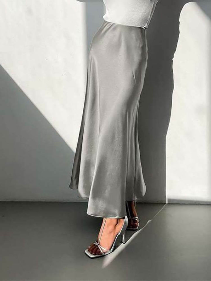 Women's flowing A-line midi skirt in vibrant blue, elegant design, perfect for versatile evening or casual wear.