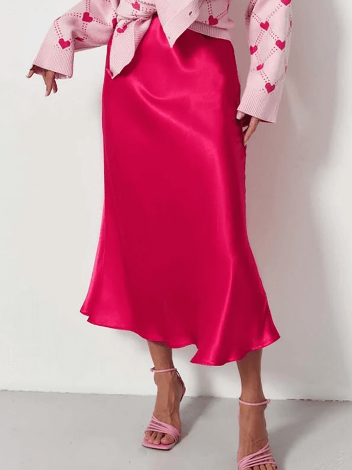 Versatile purple A-line midi skirt for women, elegant flowing silhouette, suitable for various evening and day occasions.