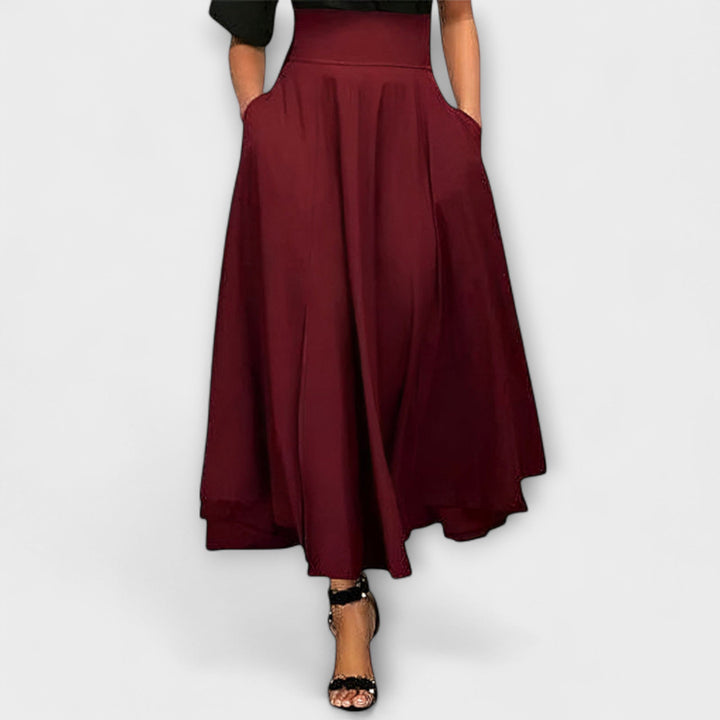 Chic red long maxi skirt for women, offering a graceful flowing silhouette for parties & special events.