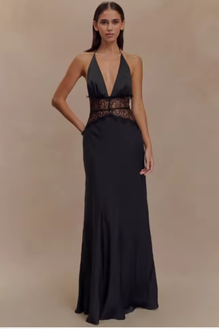 Stunning blue backless halter neck maxi dress for women, an elegant evening gown for parties.