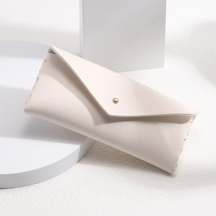 Minimalist leather phone wallet case with card holder, snap closure, and elegant design for everyday carry.