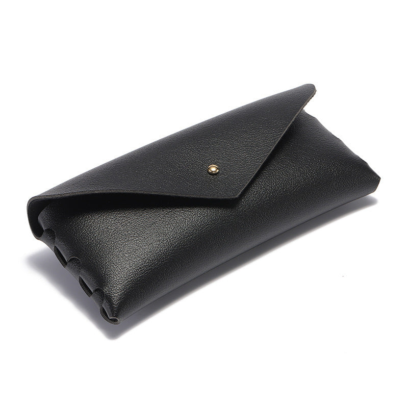 Premium black leather phone case, minimalist elegant design, durable snap closure, and convenient card holder.