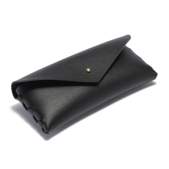 Premium black leather phone case, minimalist elegant design, durable snap closure, and convenient card holder.