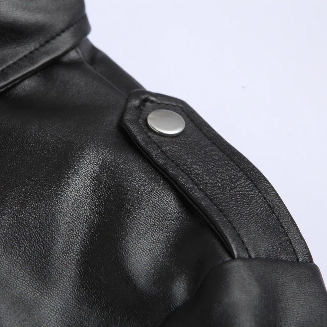 Close-up of a stylish men's bomber jacket showing elegant epaulettes, zip pockets, and a belted hem.