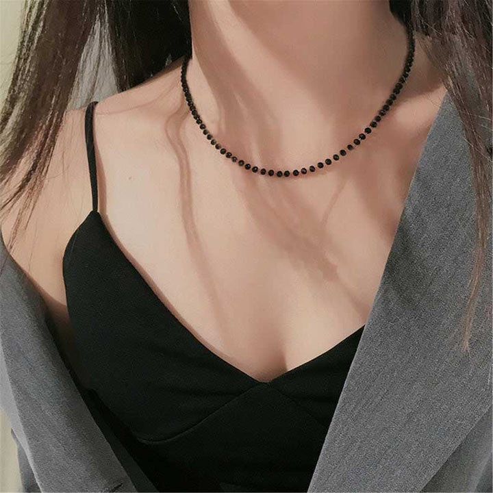 Elegant black minimalist beaded choker necklace for women, a stylish fashion jewelry accessory.