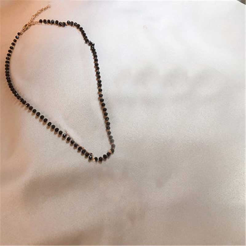 Delicate black bead choker necklace, a minimalist and versatile women's fashion jewelry.