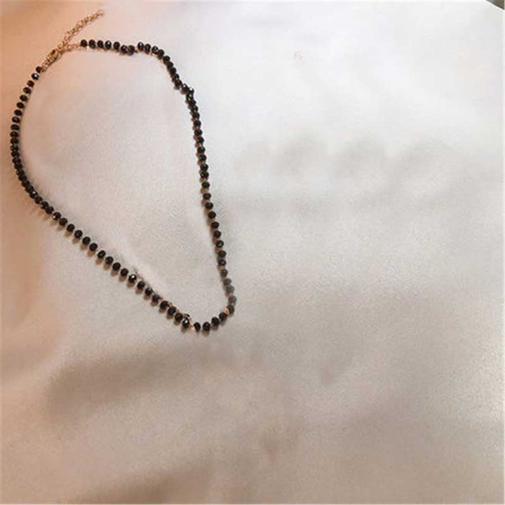 Delicate black bead choker necklace, a minimalist and versatile women's fashion jewelry.