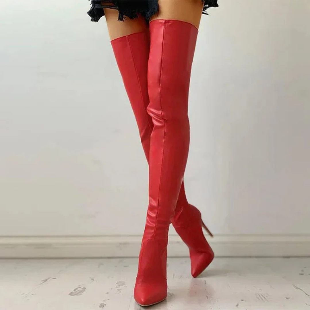Elegant black thigh-high boots for women, featuring a pointed toe, high heel, and side zipper. Perfect for evening wear.