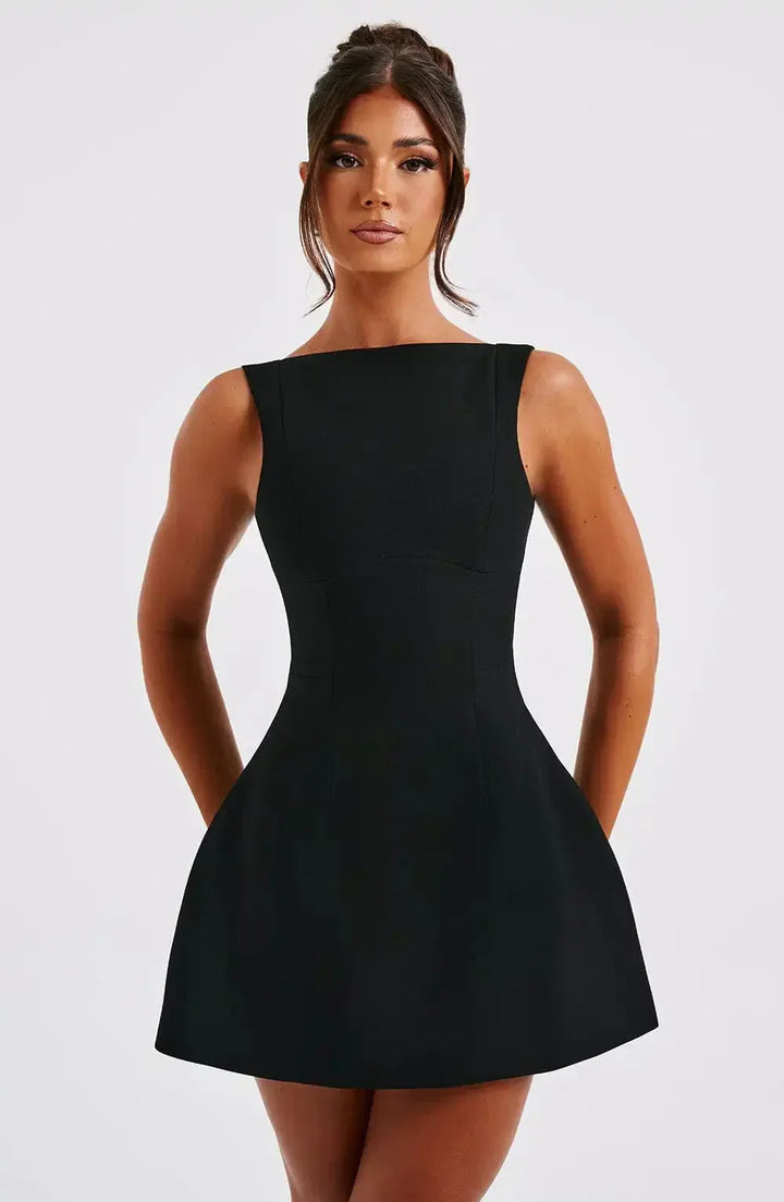 Elegant black & white A-line mini dress with boat neck, perfect for women's party or cocktail wear.