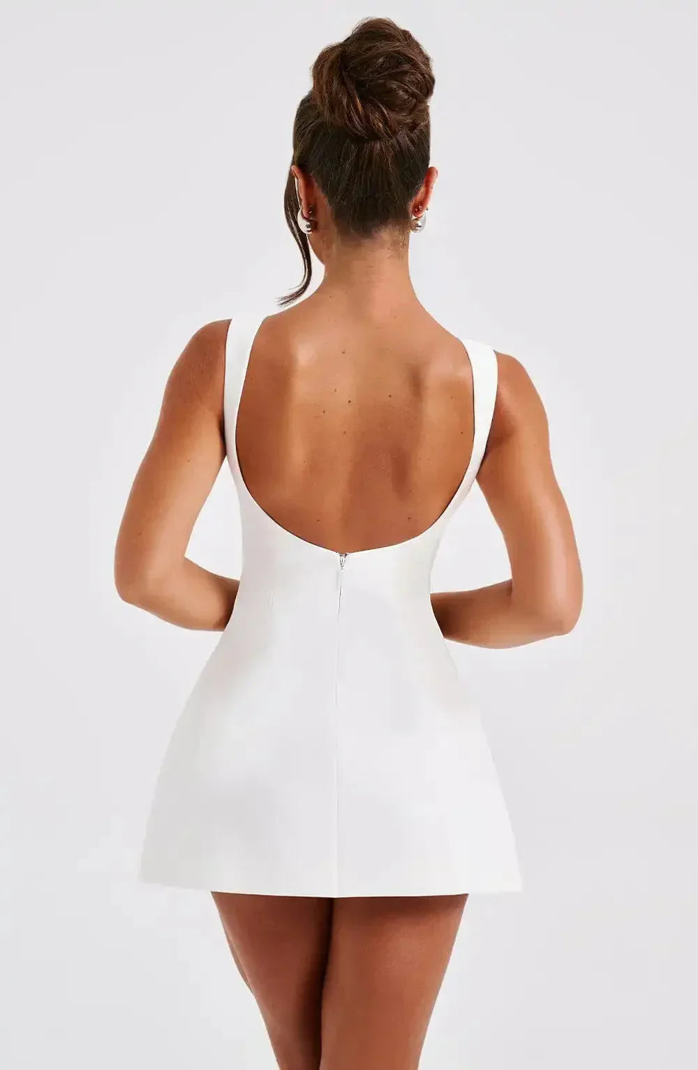 Stylish women's black & white A-line mini dress featuring a classic boat neck. Chic and versatile.