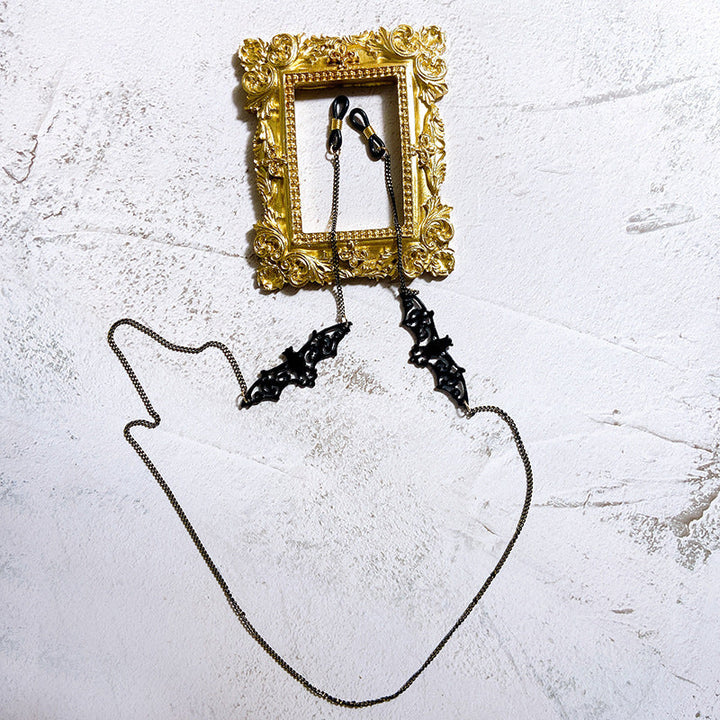 Black elegant necklace chain with a discreet jewelry holder, ideal for women to wear valuable pendants.