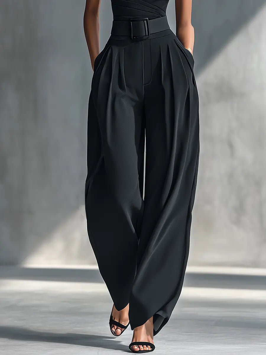 Chic women's one-shoulder black trouser set with elegant wide-leg pants. Modern two-piece outfit for special occasions.