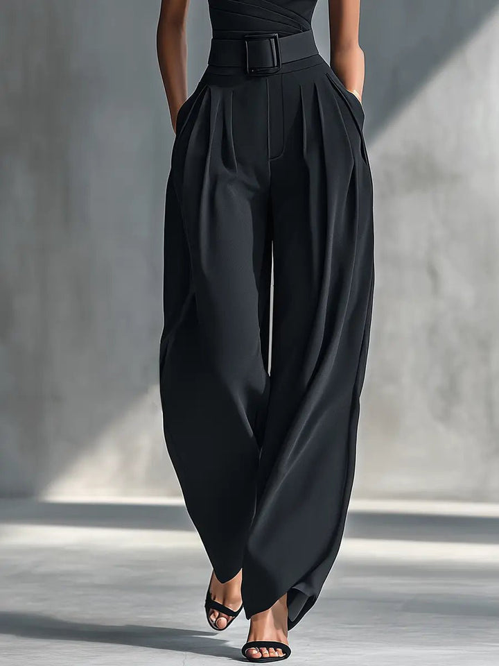 Chic women's one-shoulder black trouser set with elegant wide-leg pants. Modern two-piece outfit for special occasions.