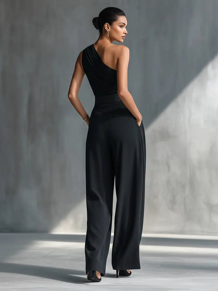 Stylish women's black one-shoulder top & flowy wide-leg trousers. Versatile two-piece set for elegant day-to-night fashion.