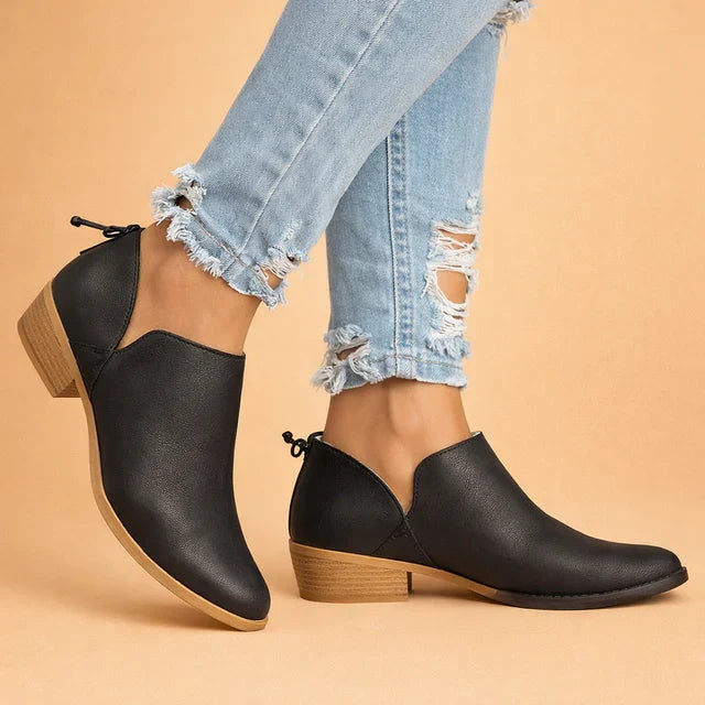 Chic women's fashion ankle boots, featuring a sleek slip-on design and elegant mid-heel for versatile dressing.