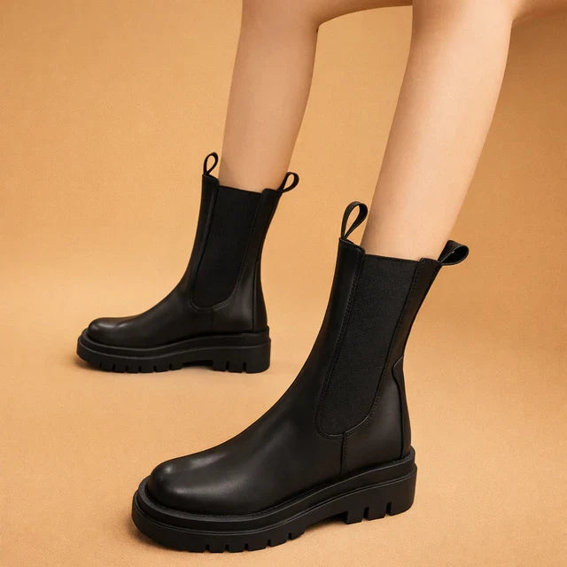 Women's elegant high boots in black. Slip-on design for ultimate comfort & versatile fashion footwear.