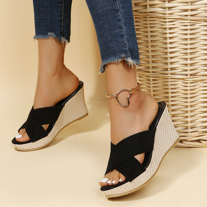 Fashionable black wedge sandals for women, designed for ultimate comfort and elegant summer styling.