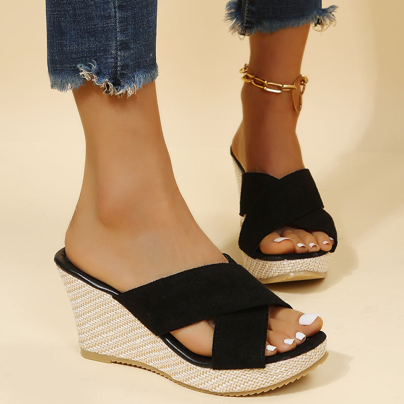 Versatile beige wedge sandals, offering comfortable support and chic style for women's summer outfits.