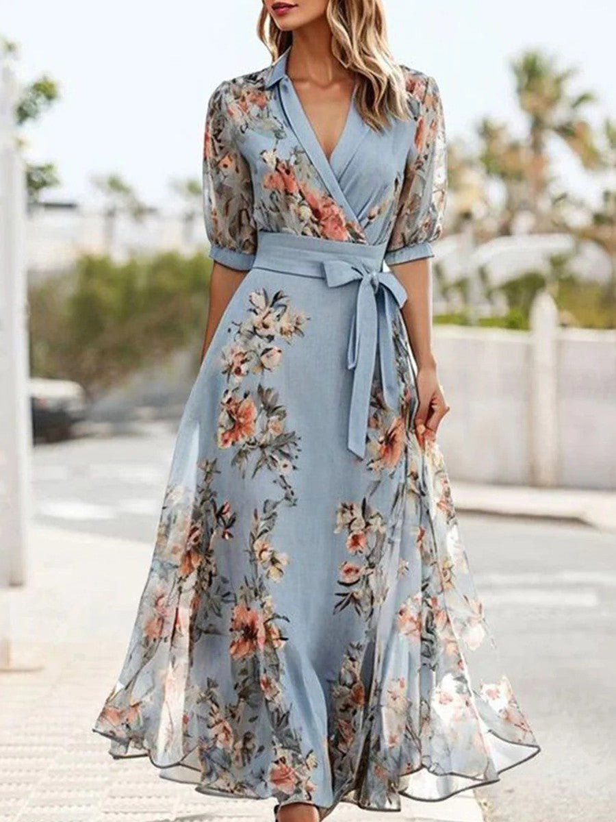 Stylish women's spring/summer blue floral V-neck midi dress, versatile for garden parties & elegant evening wear.