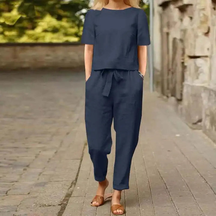 Elegant blue women's jumpsuit set, versatile for dressy casual or chic occasions, comfortable one-piece outfit.