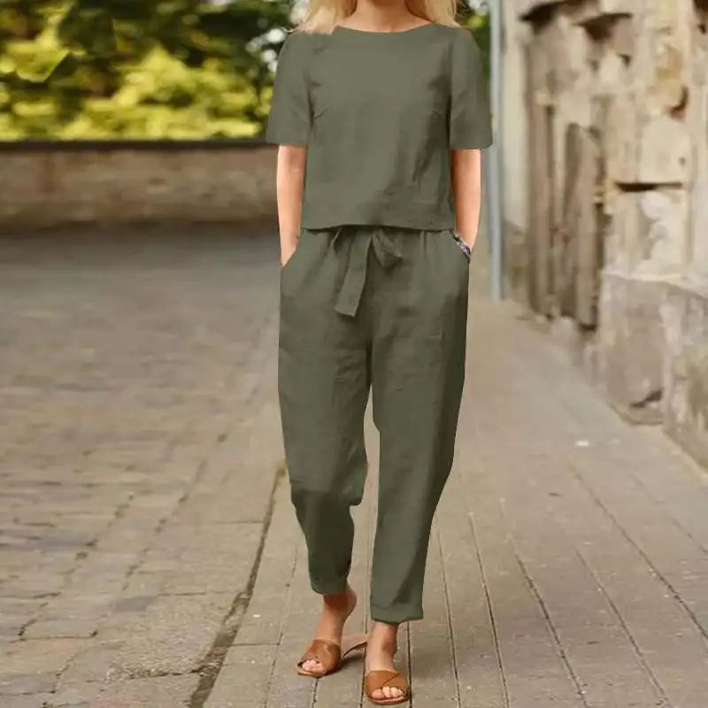 Green women's elegant jumpsuit, a versatile one-piece outfit for comfortable and stylish fashion wear.