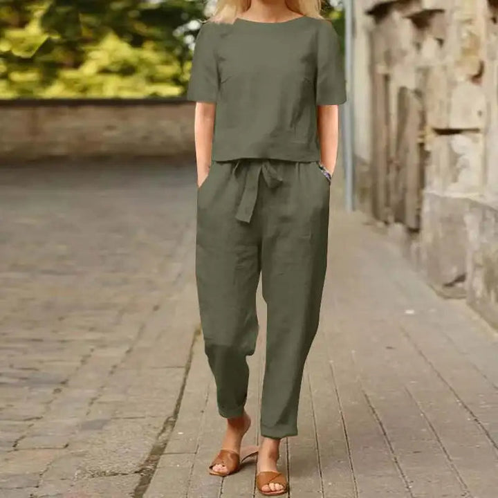 Green women's elegant jumpsuit, a versatile one-piece outfit for comfortable and stylish fashion wear.