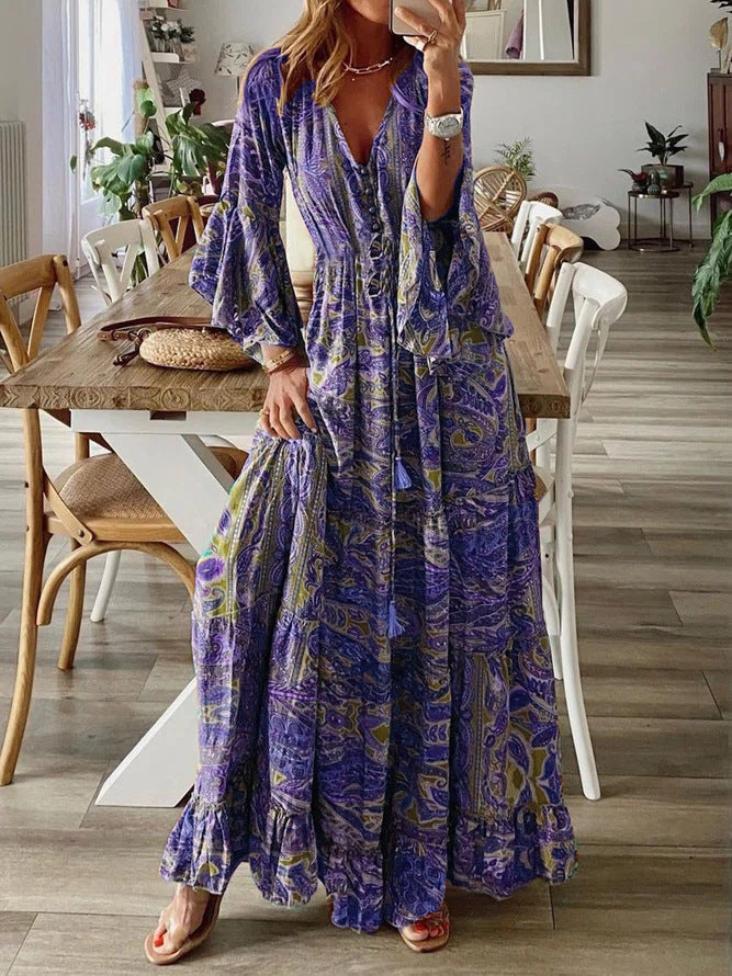 Bohemian maxi dress for women featuring elegant paisley print & flared bell sleeves.