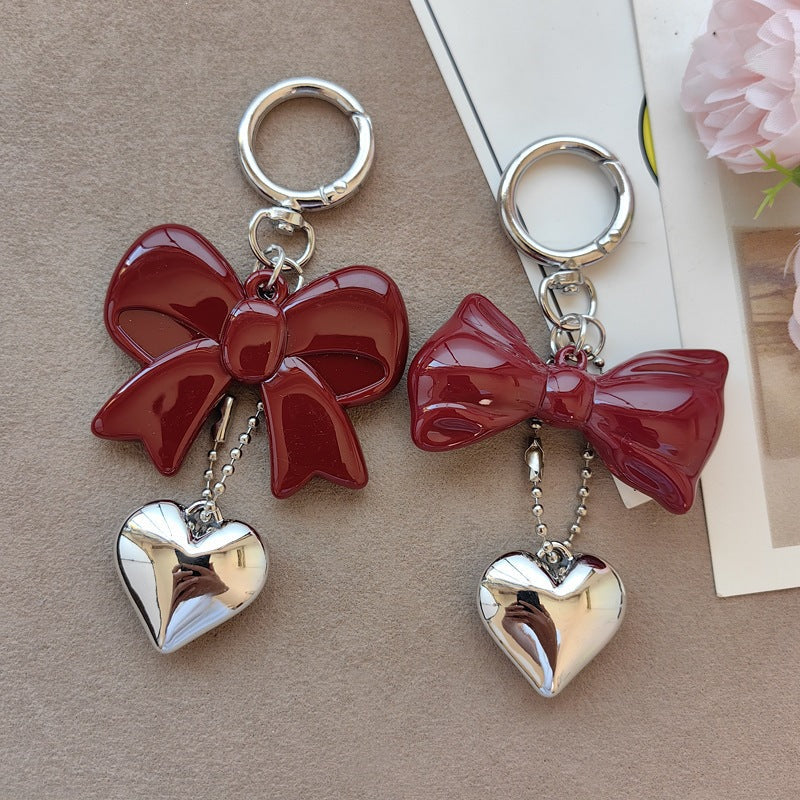 Chic women's bow & heart keychain, ideal fashion accessory or bag charm. A charming gift for women.