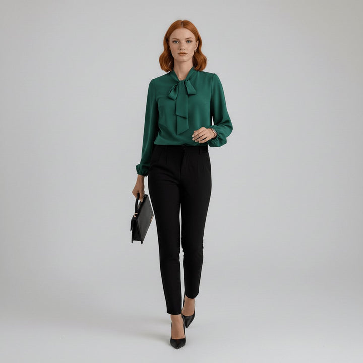 Professional women's workwear blouse with an elegant bow-tie neck and comfortable long sleeves.