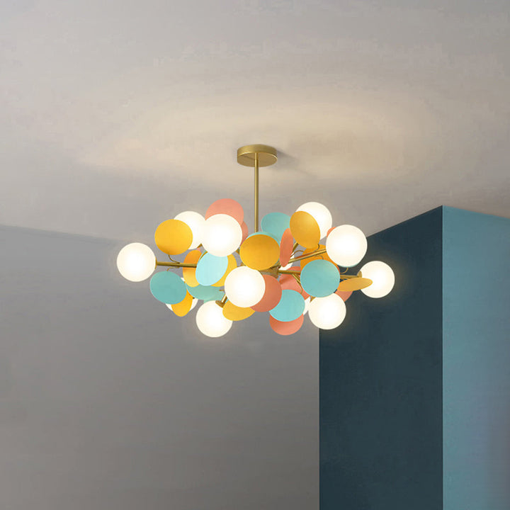 Contemporary flush mount chandelier with a captivating branch motif and acrylic flower shades.