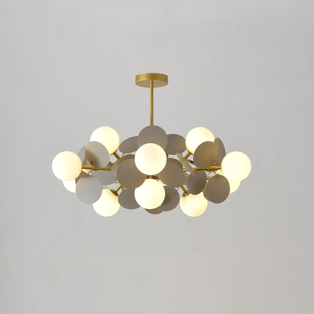 Contemporary flush mount light with a sleek branch design and subtle glass accents.