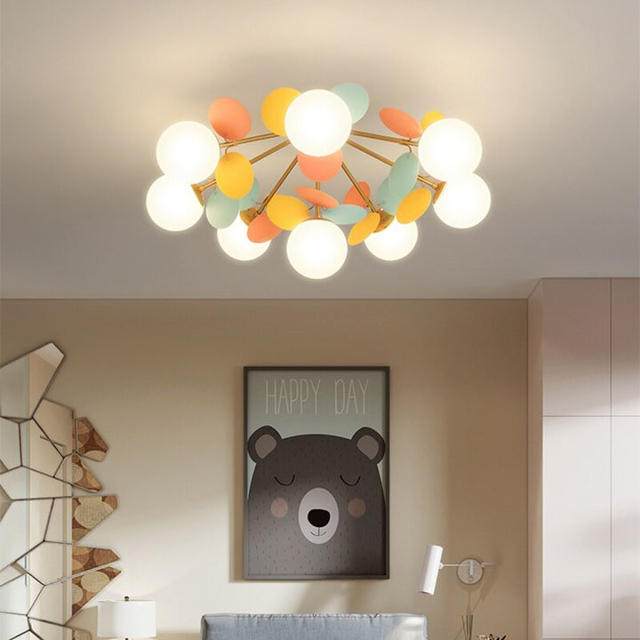 Chic flush mount ceiling light with artistic branch design and acrylic flower shades.