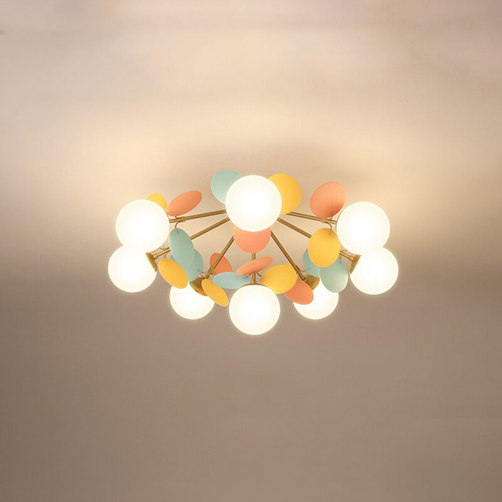 Sophisticated flush mount LED light, metal branch design with decorative glass elements.